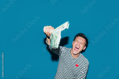 Happy Man Holding Money  photo