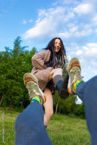 model and photographer shoving feet
