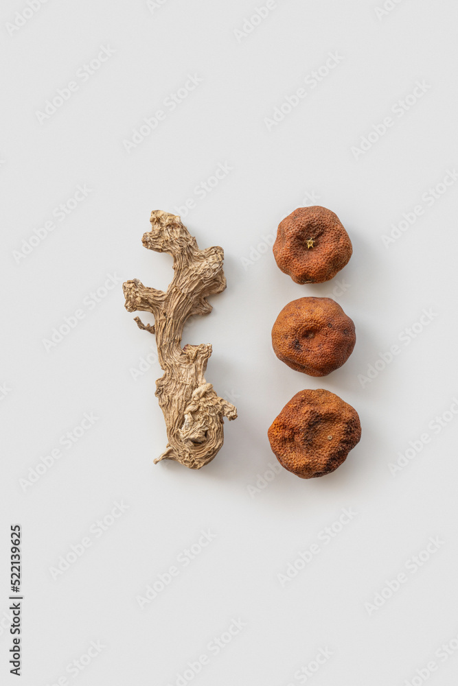 Dried tangerines and ginger root. Dried tangerines and ginger root.