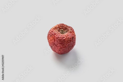 Shriveled red apple photo