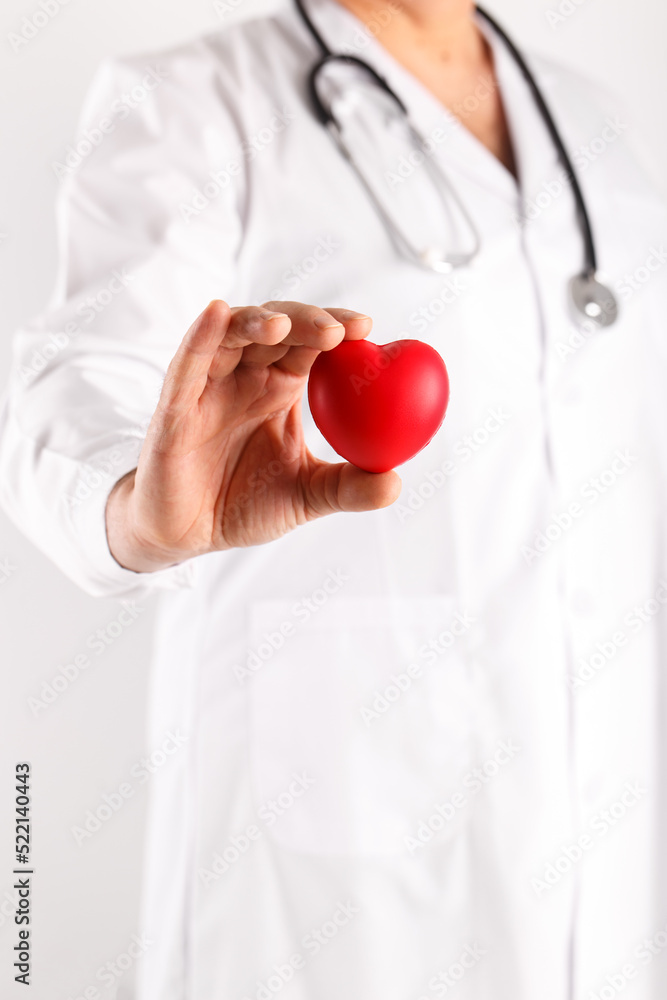 Male doctor holding heart in hands symbol of health Male doctor holding heart in hands symbol of health