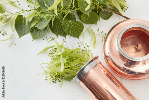 Distilling apparatus with linden leaves photo