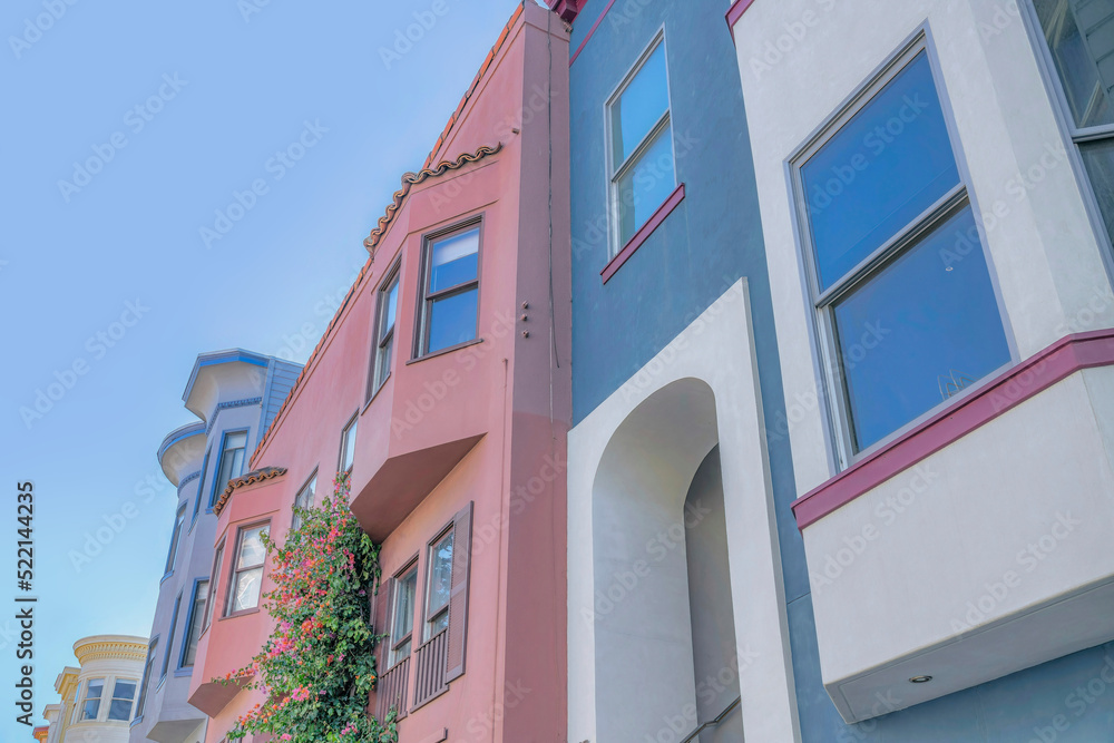 Low angle view of colorful row of houses in San Francisco, CA