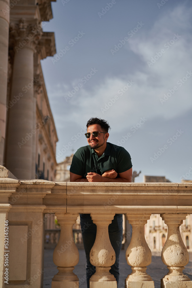 A man standing at a historical site A man standing at a historical site