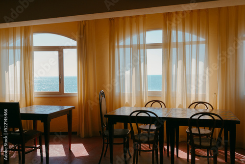 Empty dining room in hotel with warm light 