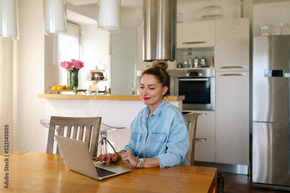 Woman Typing On Her Laptop