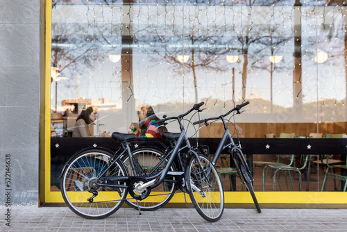 Bicycles parked outside showcase restaurant photo