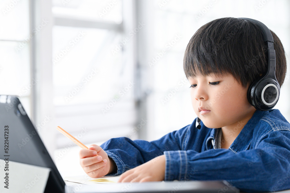 Boy teaches online class on a tablet Boy teaches online class on a tablet