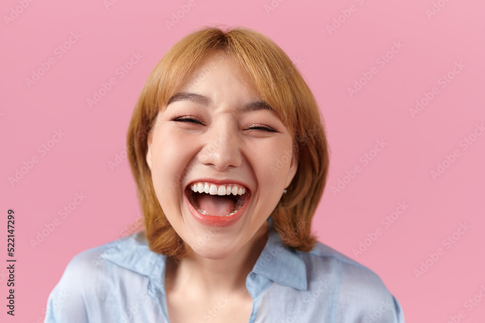 Happy cheerful young woman on pink background Happy cheerful young woman on pink background