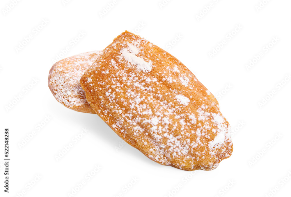 Delicious homemade madeleine cakes with powdered sugar on white background Delicious homemade madeleine cakes with powdered sugar on white background