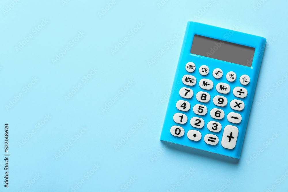 Light blue calculator on turquoise background, top view. Space for text Light blue calculator on turquoise background, top view. Space for text
