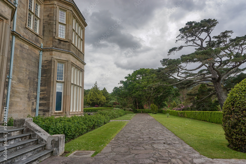 Killarney National Park, Co. Kerry, Ireland: A walkway along the side of Muckross House, a 65-room Victorian mansion built in 1843.