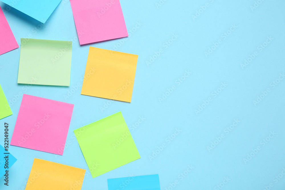 Blank colorful sticky notes on turquoise background, flat lay. Space for text Blank colorful sticky notes on turquoise background, flat lay. Space for text