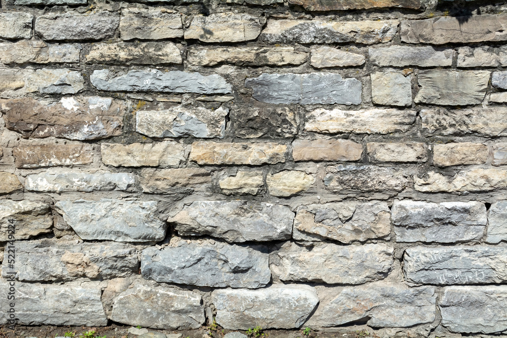 Photo of a stone wall. Abstract background.
