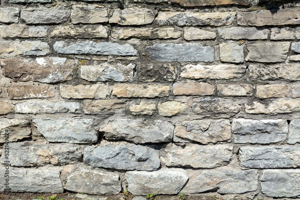 Photo of a stone wall. Abstract background. Photo of a stone wall. Abstract background.
