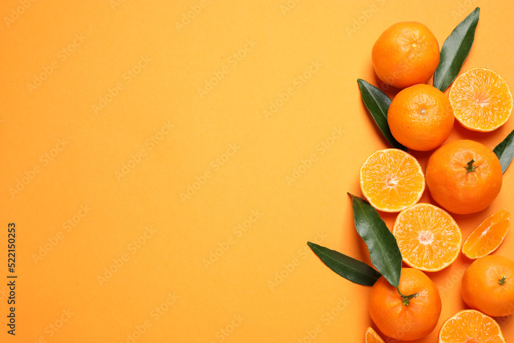 Flat lay composition with fresh ripe tangerines and space for text on orange background. Citrus fruit - obrazy, fototapety, plakaty 