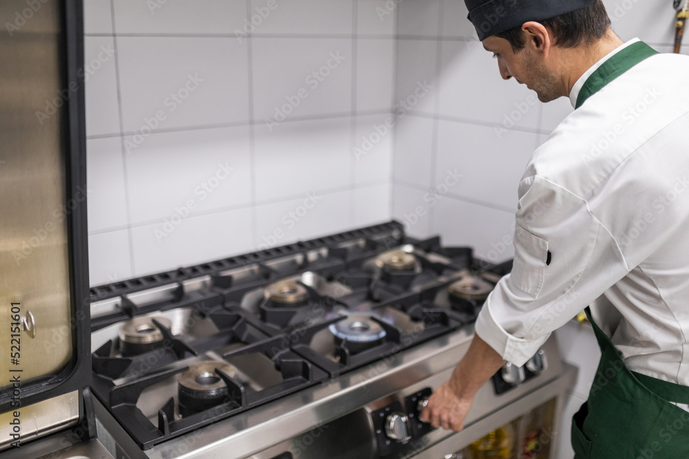 chef cooking in the kitchen of a restaurant chef cooking in the kitchen of a restaurant