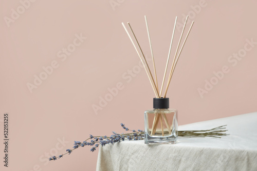 Aroma diffuser with lavender on linen tablecloth photo