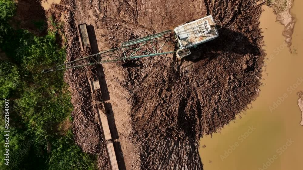 Open-pit mining. Dragline excavator load clay in freight train. Clay ...