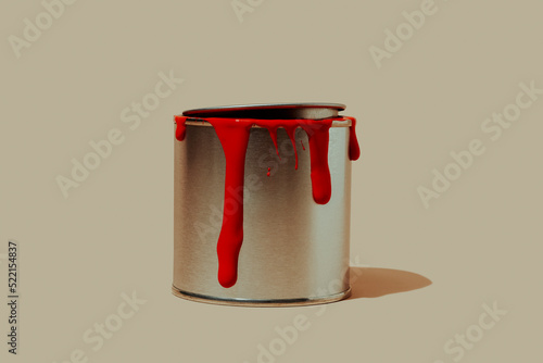paint can with stains of red paint