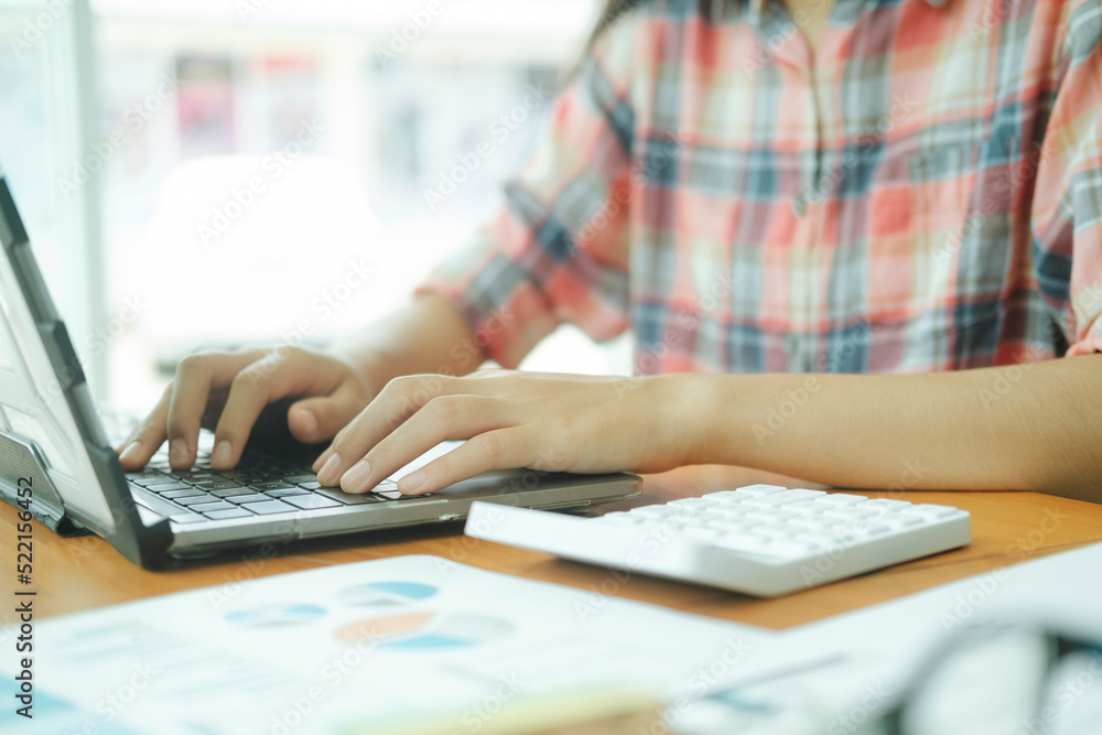 Close up young asian businesswoman analyse investment marketing data. Close up young asian businesswoman analyse investment marketing data.