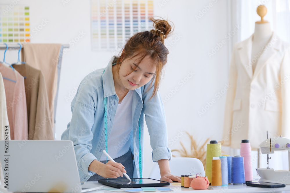 Fashion designer working in studio Fashion designer working in studio