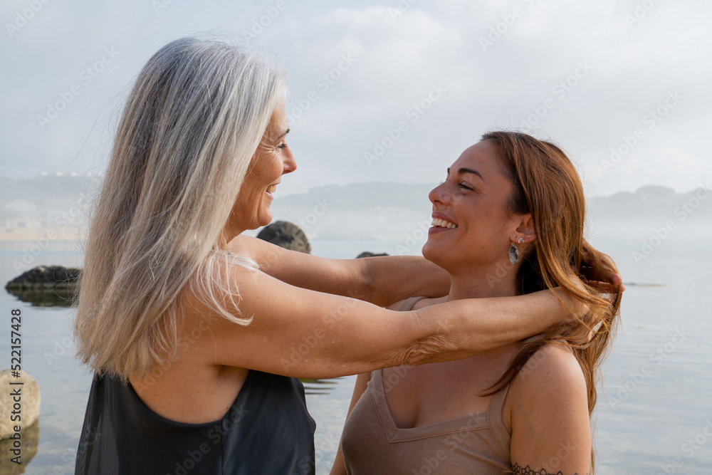 candid real Portrait of happy mother and adult daughter candid real Portrait of happy mother and adult daughter