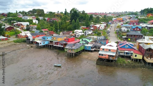 Wallpaper Mural Aerial Panning Beautiful Shot Of Houses On Hills Against Cloudy Sky - Castro, Chile Torontodigital.ca