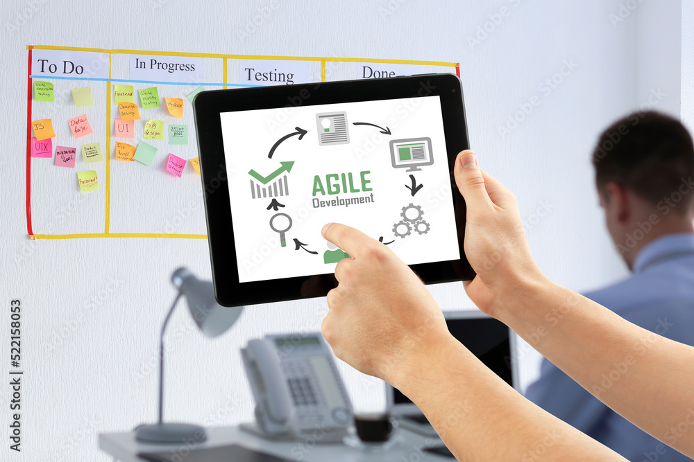 Man with tablet PC in office. Agile concept Man with tablet PC in office. Agile concept