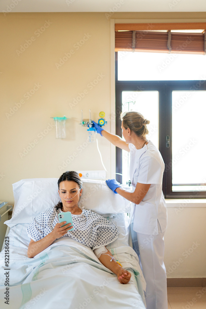 Nurse caring for patient Stock Photo | Adobe Stock