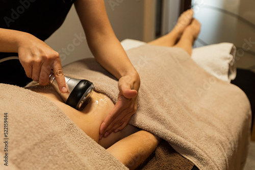 Woman receiving a cavitation massage  therapy photo