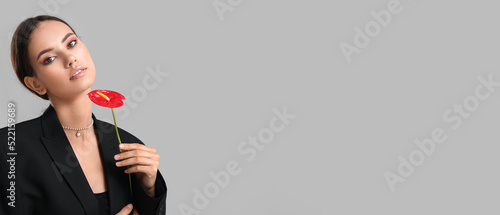 Young elegant woman holding...