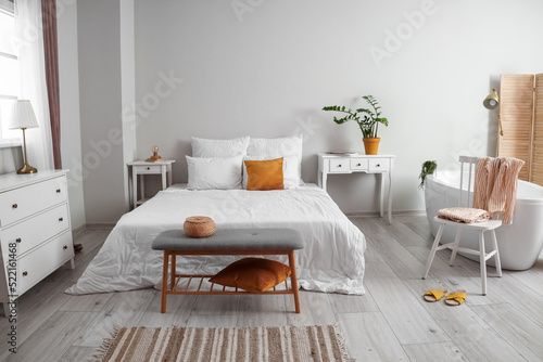 Interior of light bedroom w...