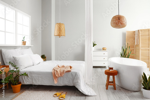 Interior of light bedroom w...