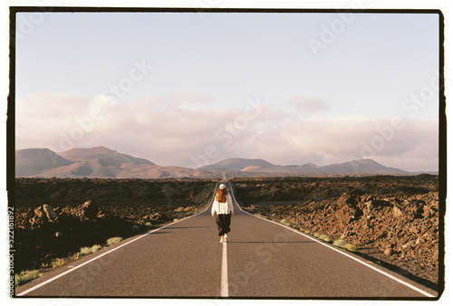 Girl walking at road landscape in Lanzarote