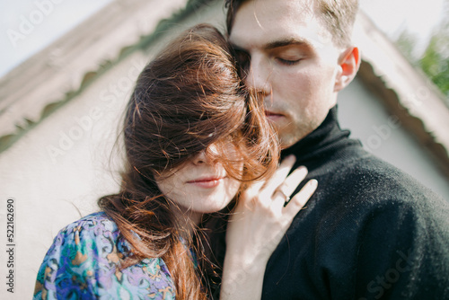 close up portrait of a young couple embracing