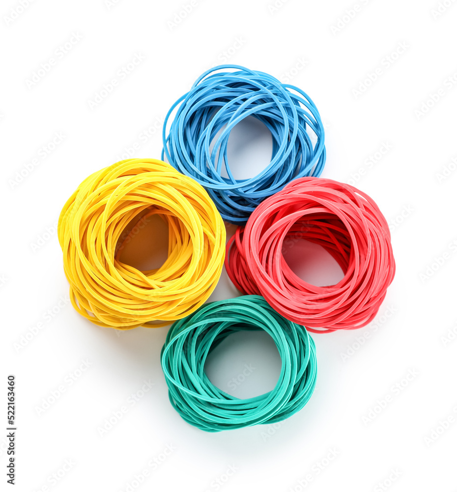 Stacks of elastic rubber bands on white background Stacks of elastic rubber bands on white background