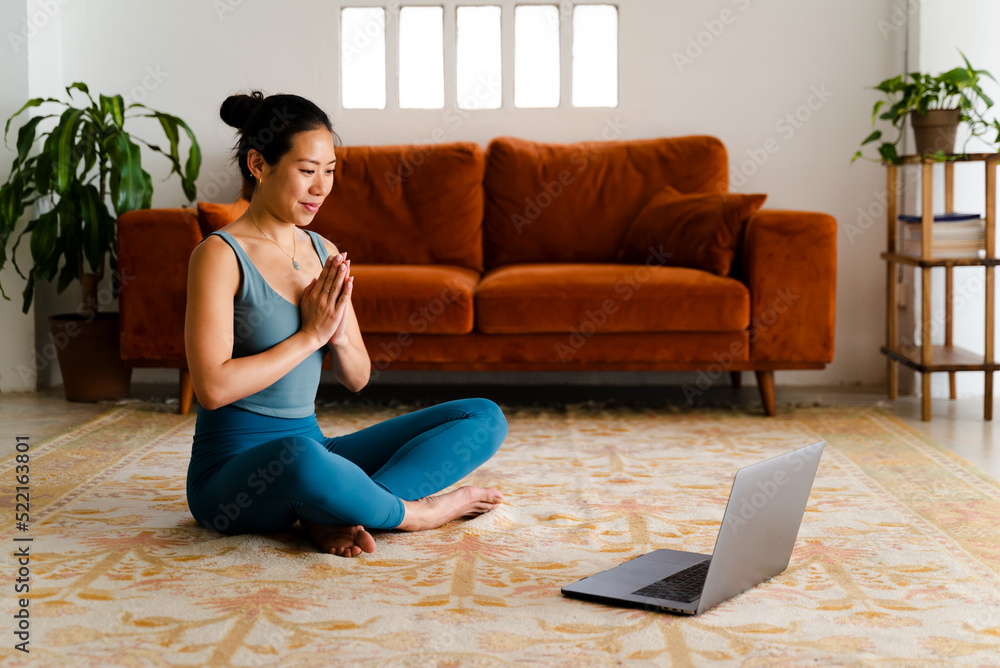 Woman Doing An Online Yoga Class Woman Doing An Online Yoga Class