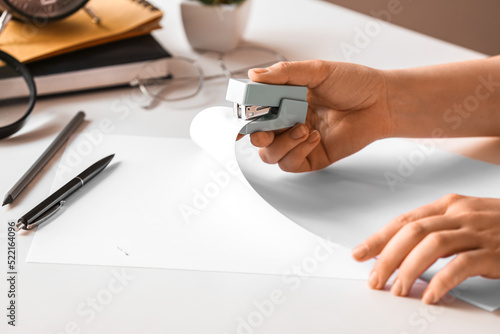 Person's hand stapling whit...