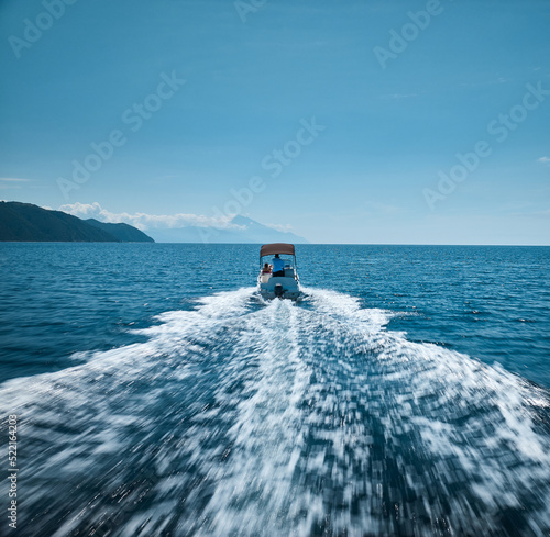 Small boat in motion photo