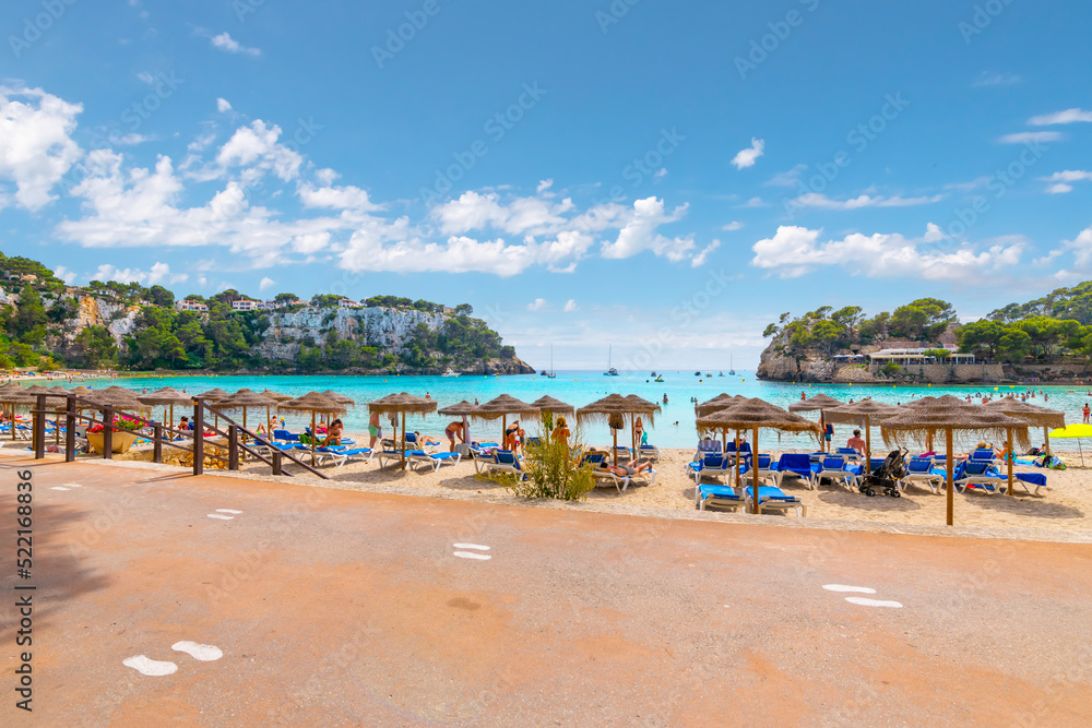 Obraz premium The popular Cala Galdana sandy beach near Serpentona, Spain, along the Mediterranean coast of the island of Menorca, Spain.