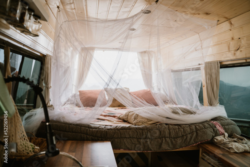 Camper van indoors with bed 