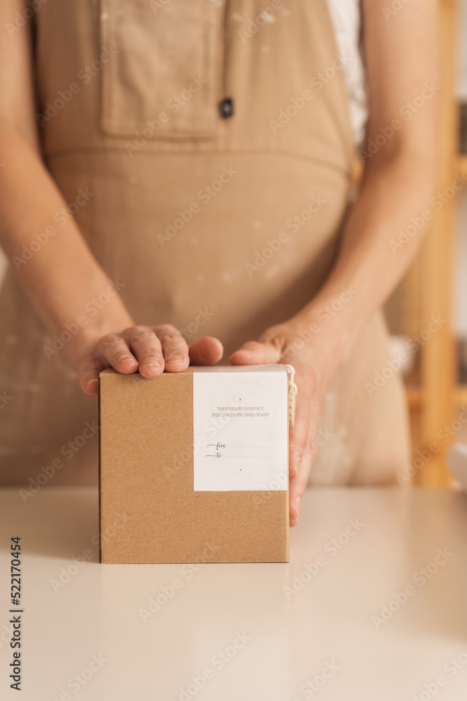 Anonymous Woman Holding A Cardboard Gift Box With A Note Anonymous Woman Holding A Cardboard Gift Box With A Note