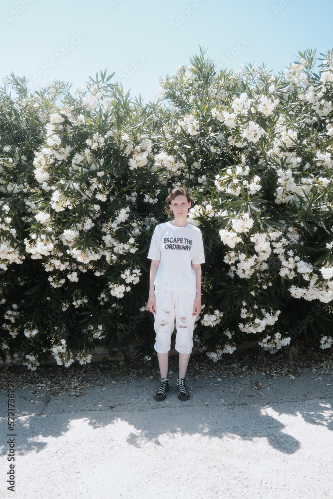 © Lucia Postike/Stocksy - Woman in a blooming park