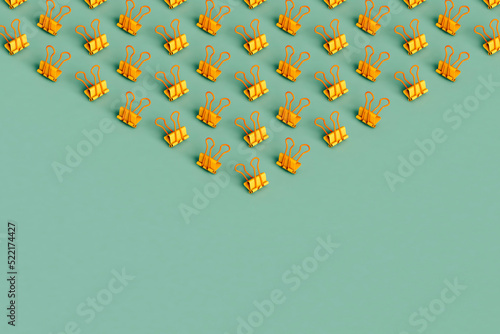 many yellow paperclips photo