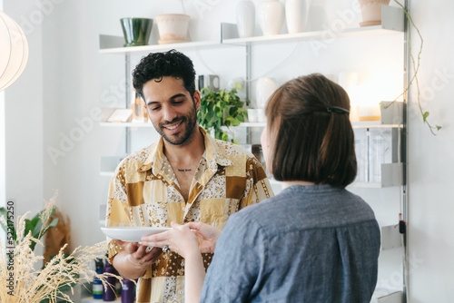 Retail Store - Shop Assistant Talking to Male Customer photo