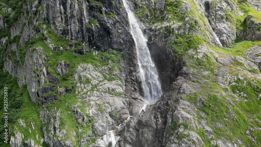 Drone push out: huge waterfall in the swiss alps viewed by drone, aerial shot, Obwald, Engelberg Drone push out: huge waterfall in the swiss alps viewed by drone, aerial shot, Obwald, Engelberg