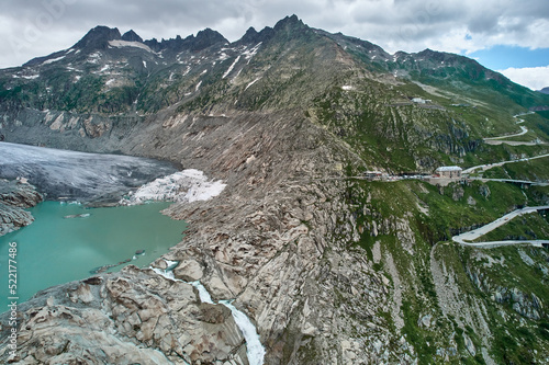 Climate change causes glacial retreat in Swiss Alps valley, Furka Pass photo