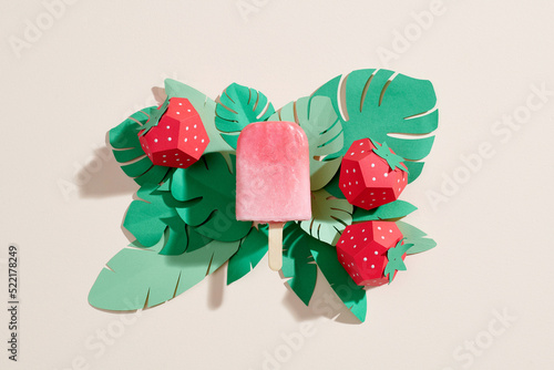 Fruit popsicles on a tropical theme background