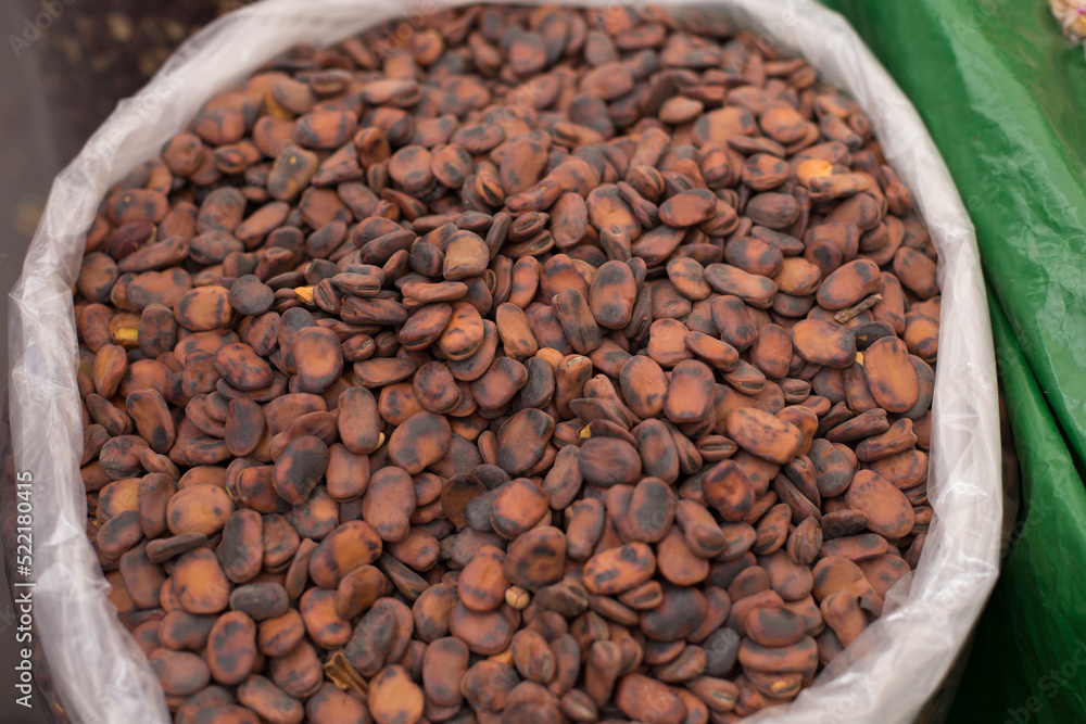 Fototapeta premium Photograph of roasted broads beans in a local market in Peru. Traditional food concept.